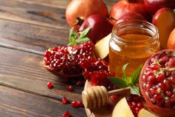 Autumn fruits arranged on a wooden table with copy space