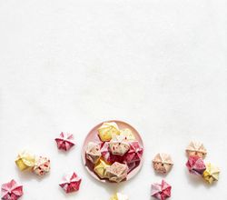 Meringue kisses flat lay on marble tabletop
