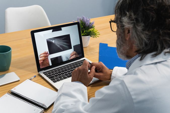 Doctor conducting telemedicine consultation with patient