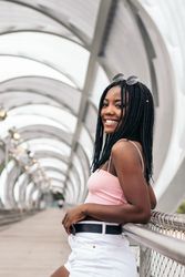 Portrait of a Black young woman enjoying the summer in the city