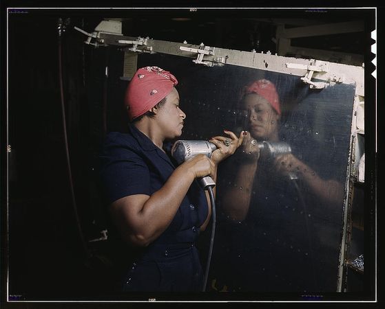 Nashville, TN, USA - 1940s: Female operating a hand drill at Vultee-Nashville