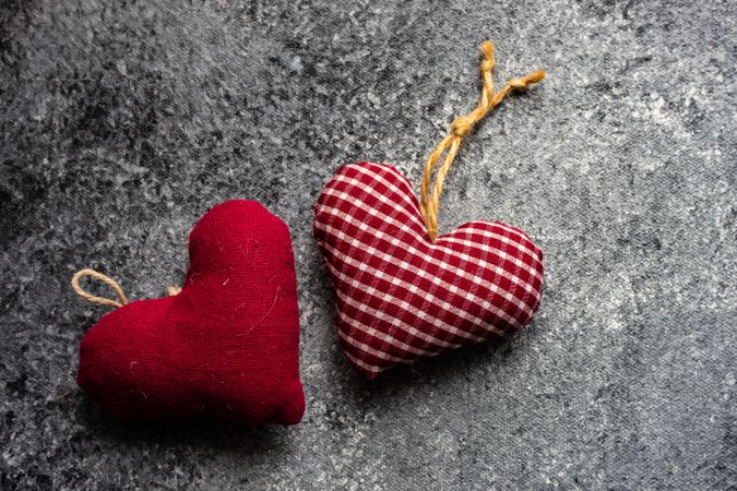 Valentine's day concept with red felt heart ornamants on grey counter