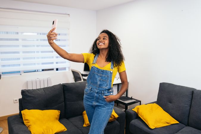 Smiling Selfie: Young Black Woman in Yellow Shirt