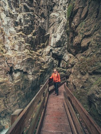 Traveller enjoying picturesque view of mountain ridge