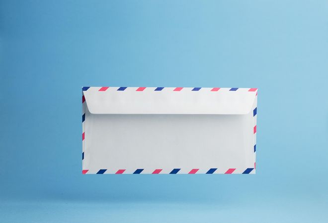 Floating envelope over light blue background