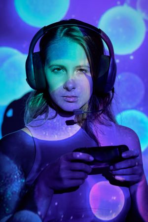 Serious female gamer looking at camera