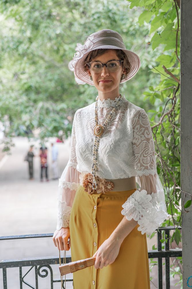 Woman with retro fan in park