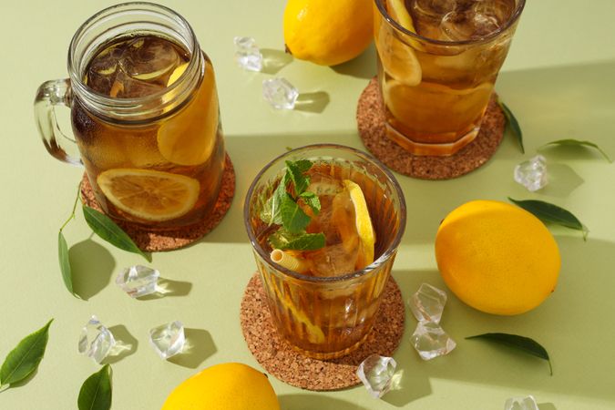 Cold tea with ice, mint leaves and orange slices