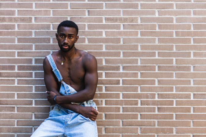 Fit Black man in overalls in city