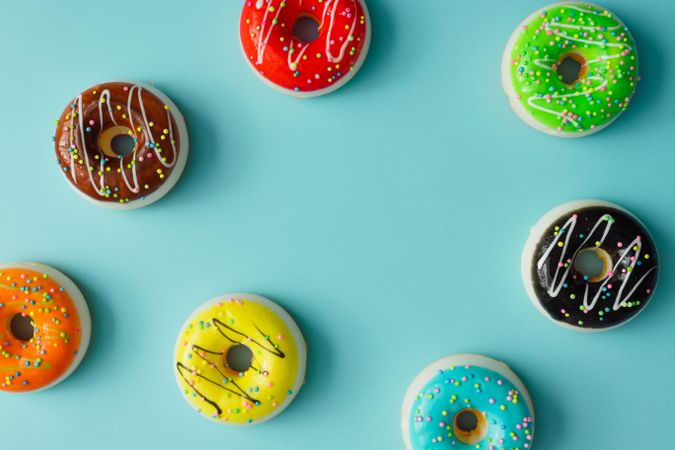 Colorful donuts on blue background
