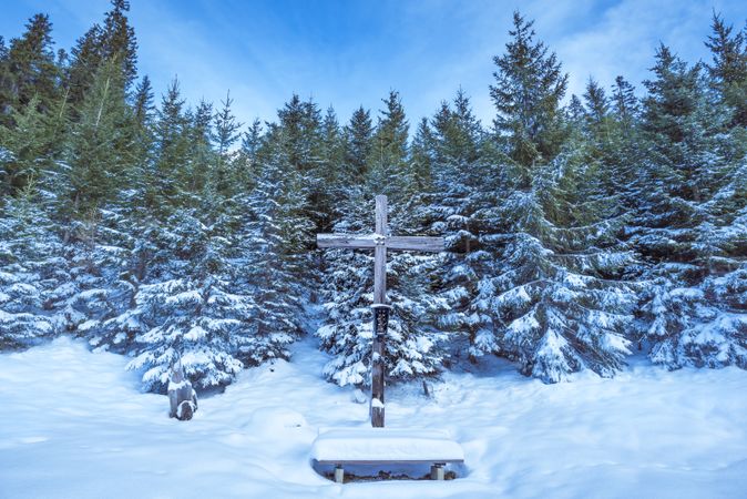 Wooden cross in winter scenery