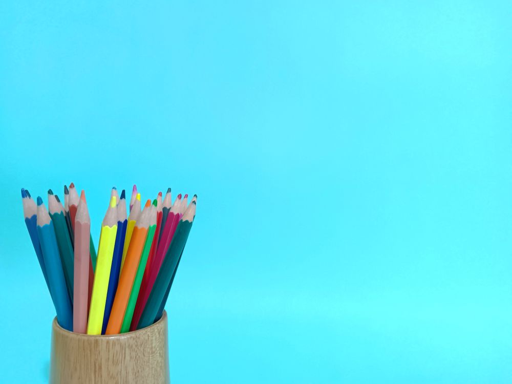 Color pencil layout space on light blue background