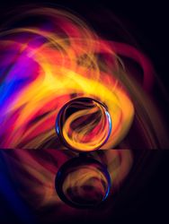 Crystal ball on board near abstract shines