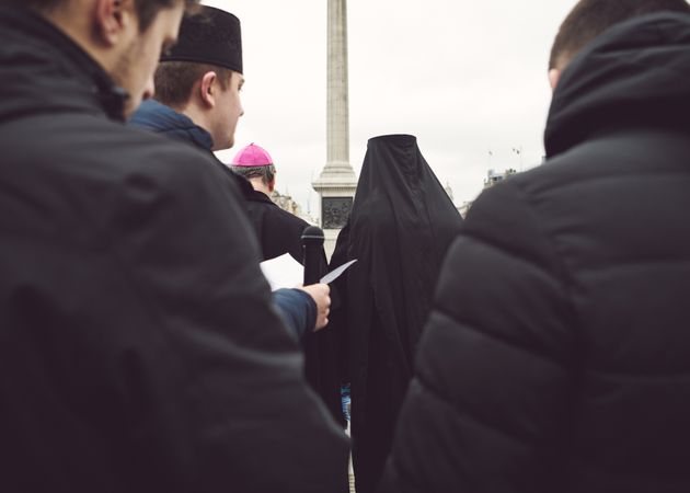London, England, United Kingdom - March 5 2022: Back shot of group of religious men at protest