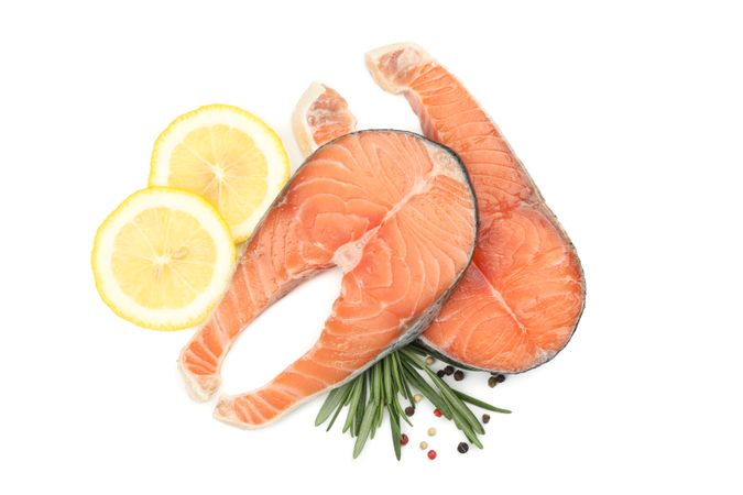 Fresh raw salmon meat and spices isolated on light background