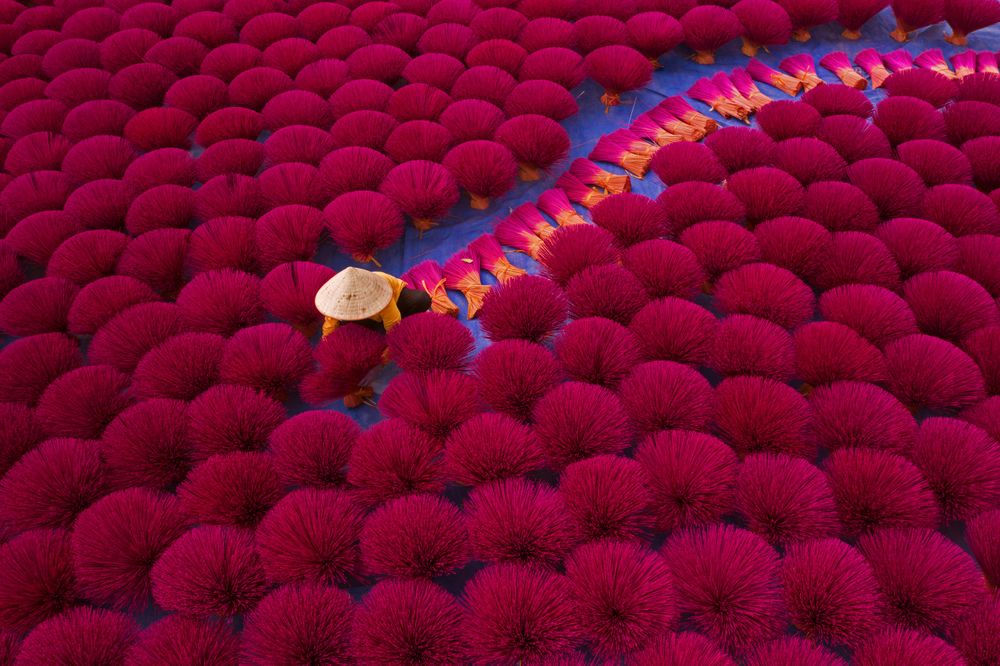 Top view of Vietnamese workers setting up incense sticks in Quang Phu Cau, a village in Hanoi, Vietnam