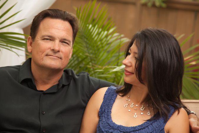 Couple Sitting In Front of Fern