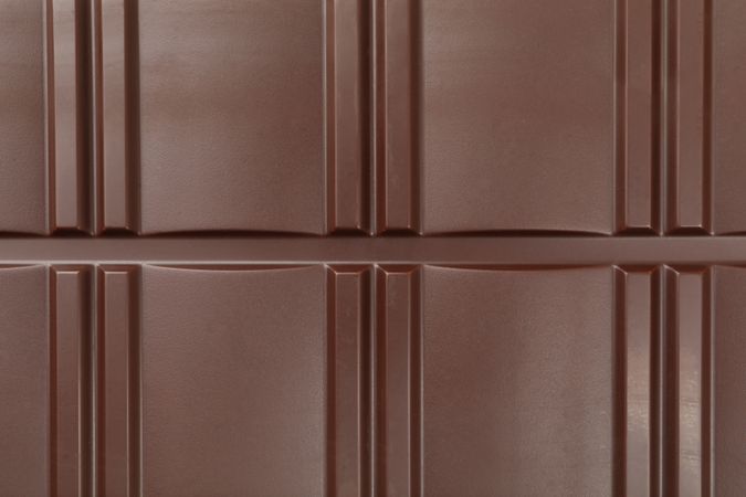 Chocolate bar texture on whole background, close up