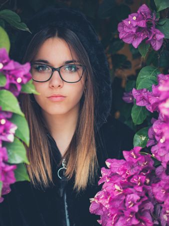 Woman on background of stunning violet flowers