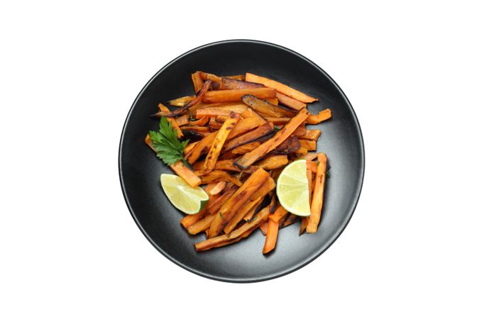 fried sweet potato in a bowl, isolated on light background