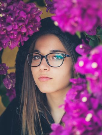 Woman on background of stunning violet flowers