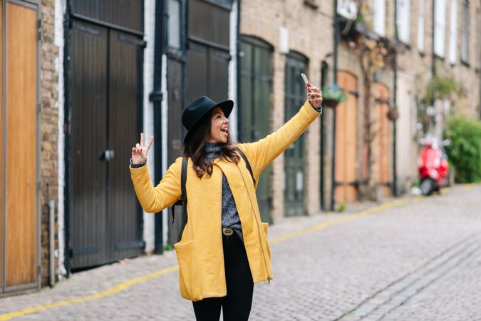 Woman taking selfie on the street