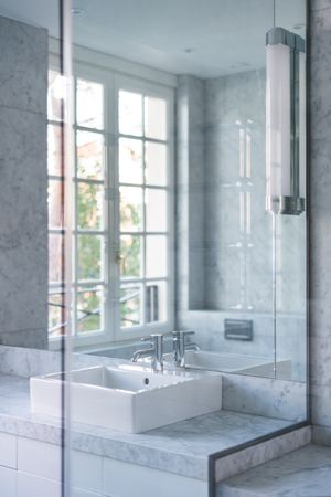 Water tap and sink and in contemporary bathroom