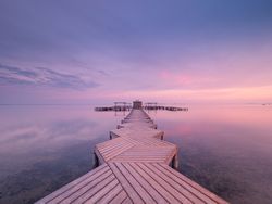 Wooden pier on cloudy evening