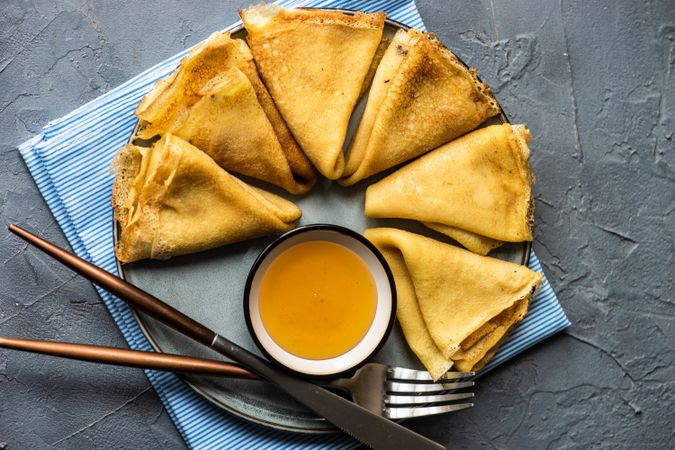 Plate with pancakes served with honey
