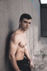 Strong male near concrete wall