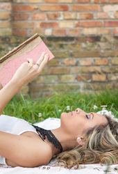 woman with book on the grass