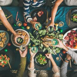 Christmas or New Year party dinner at festive table, top view, square crop