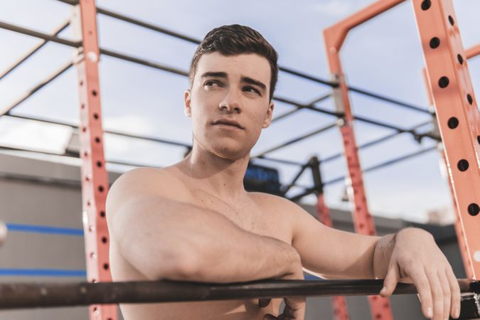 Shirtless man on sports ground