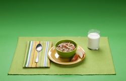 Breakfast meal of oatmeal, walnuts, apples, and low-fat milk
