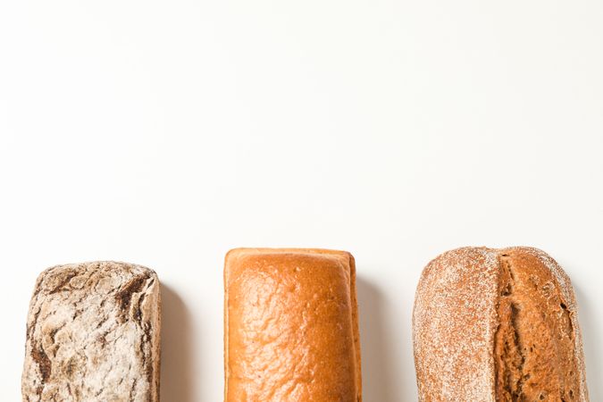 Flat lay composition with bakery products on blank background, space for text