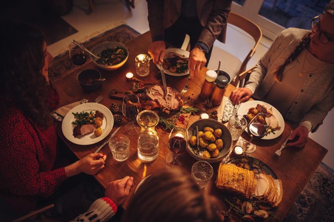 Top view of dining table during Christmas dinner at scandinavian home