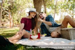 Cheerful young couple enjoying at picnic 4Zppn0