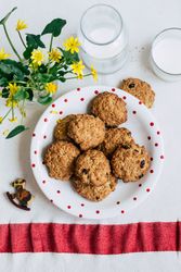 Cookies and milk near flowers