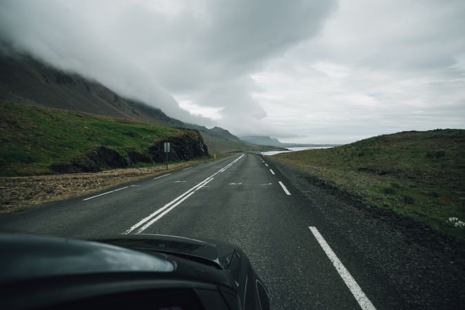 Desolate road in Iceland on overcast day as seen from vehicle
