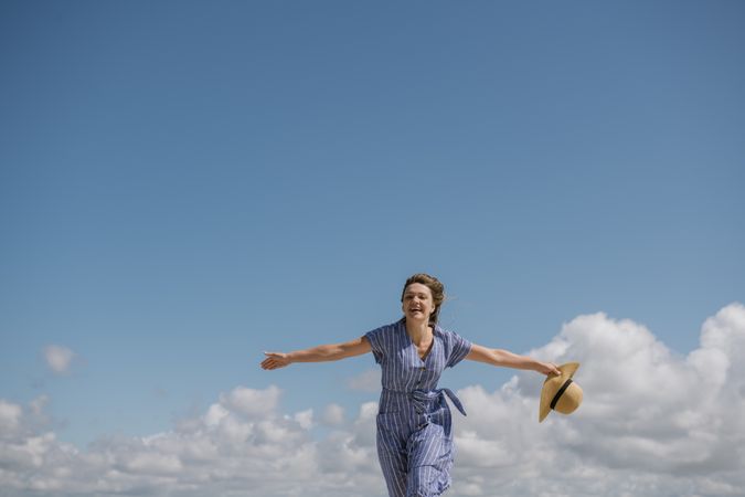 Happy young woman enjoying breeze
