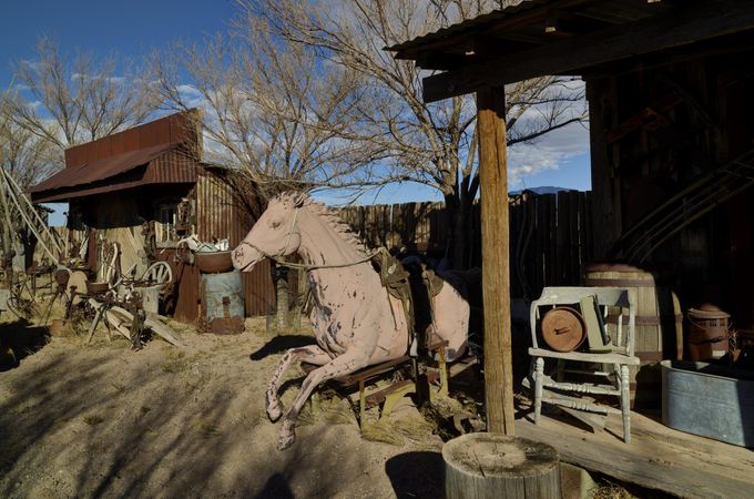 Antiques scattered in a yard, Carrizozo, New Mexico