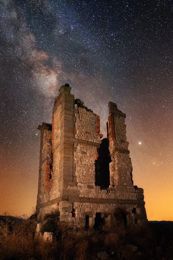 Ancient ruined building at night time
