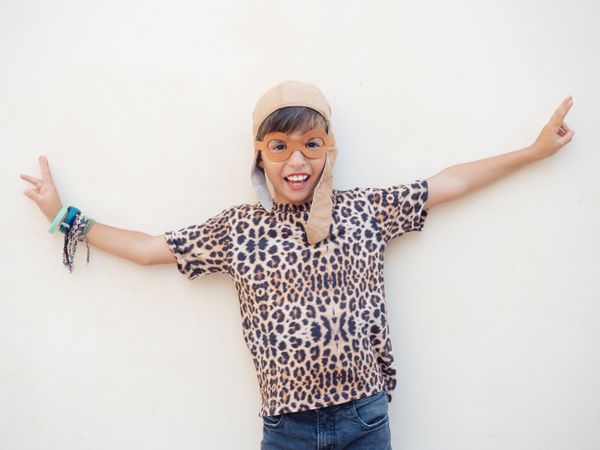 Child in leopard costume and hat with ears