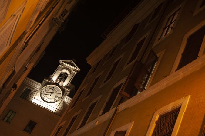 Building with clock on narrow street