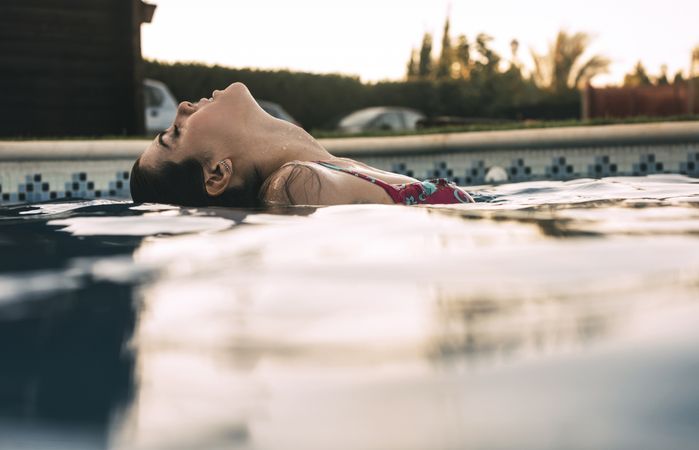 Side view of woman in pool