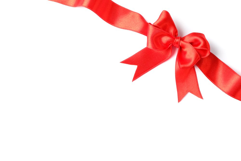 Red ribbon with bow isolated on plain background. Gift concept