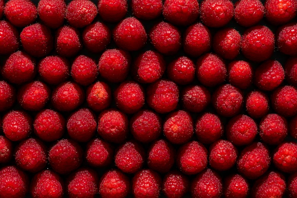 Raspberries above view, full frame background