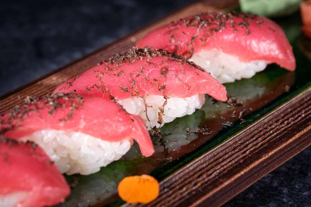 Delicious sushi set served on wooden tray