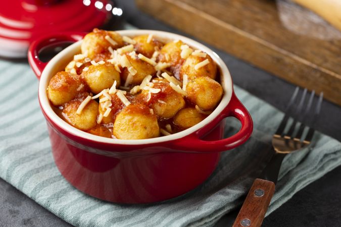 Gnocchi with tomato sauce and grated Parmesan cheese.