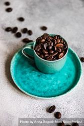 Coffee beans in teal cup 4jPXW0